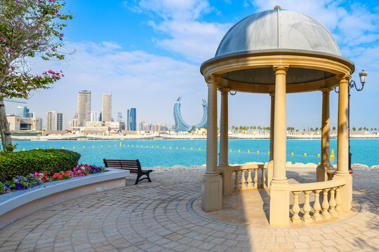 View of the downtown skyline and new construction from a gazebo located in the Porto Arabia marina area of The Pearl Island in Doha, Qatar.