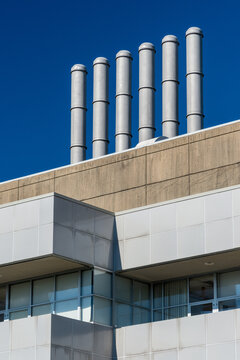 Canada, BC, Vancouver.  Smokestacks on the roof of modern building at the University of BC
