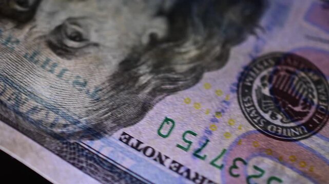 Stock of hundred dollars bills bokeh macro close up, texture, in and out of focus, abstract money finances, studio selective focus real time video