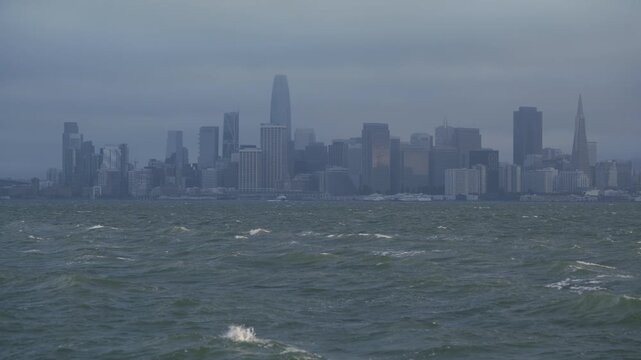 San Francisco Skyline from Bay With View Of Choppy Water During Storm - Wide Shot