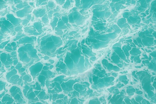 Aerial view of turquoise ocean waves with white foam patterns
