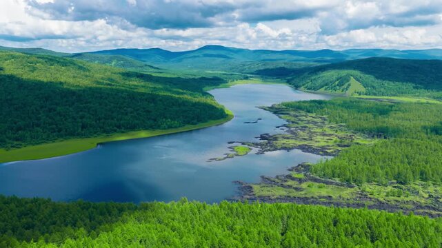 Aerial View of Serene Lake in Green Valley
