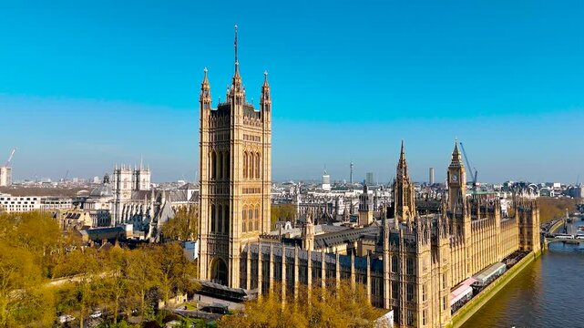 Aerial view of the Palace of Westminster in London, England, UK, on a clear day. Iconic UK landmark ideal for travel, tourism, architecture, and cultural-themed commercial use