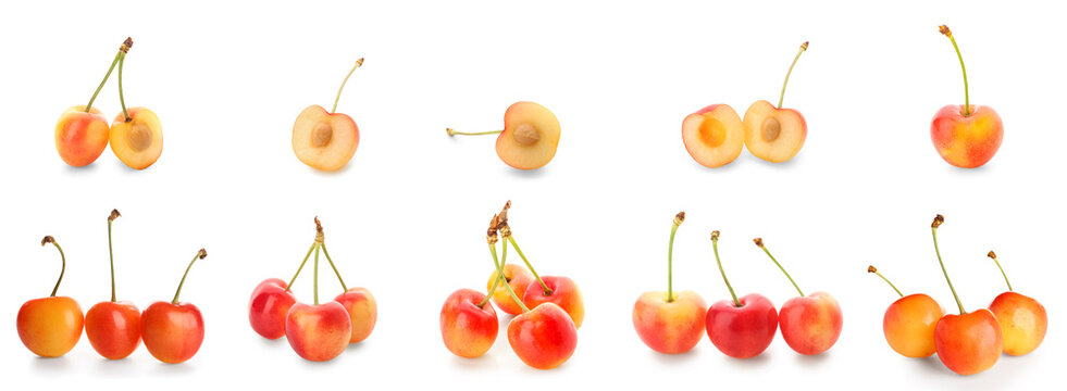 Fresh rainier cherries whole and halved on white background