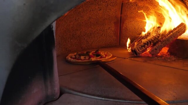 An authentic Italian Margherita pizza in its raw state, topped with vibrant red tomato sauce, fresh buffalo mozzarella pearls, cherry tomatoes, and aromatic green basil leaves, ready to be slid into a