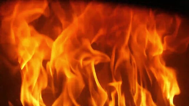 High-quality footage of vibrant orange flames and glowing embers consuming charred wooden logs inside a rustic brick pizza oven. This shot captures the authentic atmosphere of a traditional Italian pi
