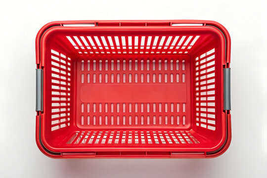 Overhead view of a vibrant red plastic shopping basket on png, shopping basket, red basket, plastic basket, store basket, supermarket basket, shopping container, retail, grocery, market, container