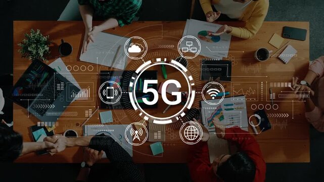 Collaboration on 5G Technology Development with Diverse Team Members at Table Surrounded by Digital Icons and Graphs. Entropy.