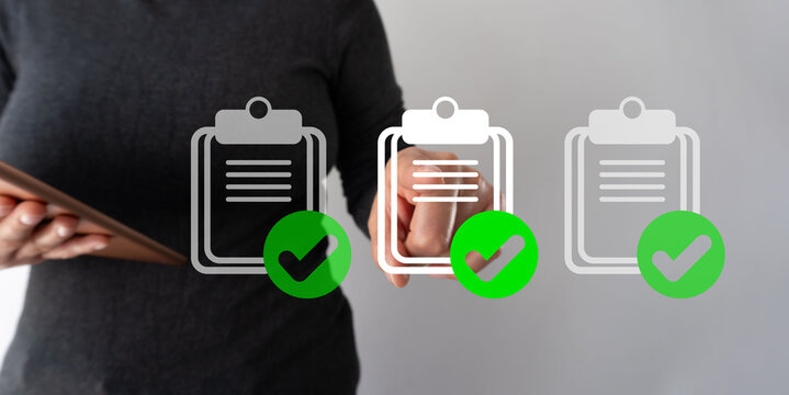 Person holds tablet, taps checklist icons. Green ticks show completed tasks. Image suggests productivity, organization, or task management. Ideal for business, work, or education themes