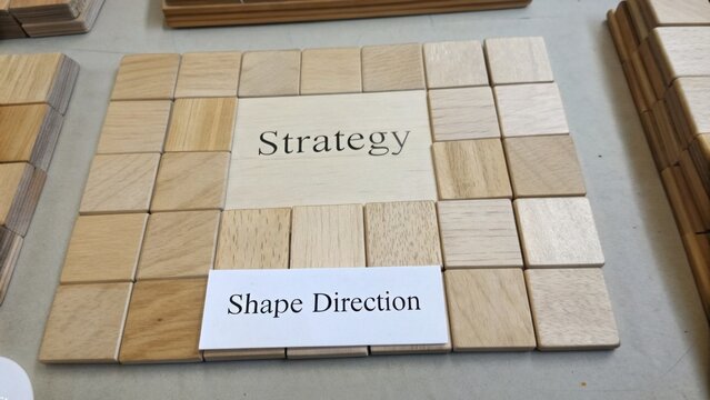 Wooden Puzzle Pieces Arranging Strategy and Shape Direction in Educational or Team-Building Activities
