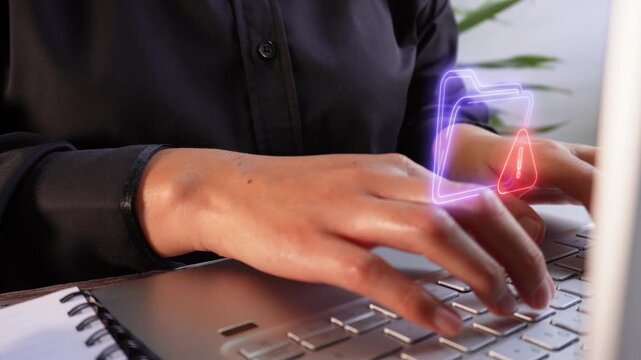 Error or conflict in digital files. Close-up of a businesswoman working on her computer with a virtual folder icon and a warning sign