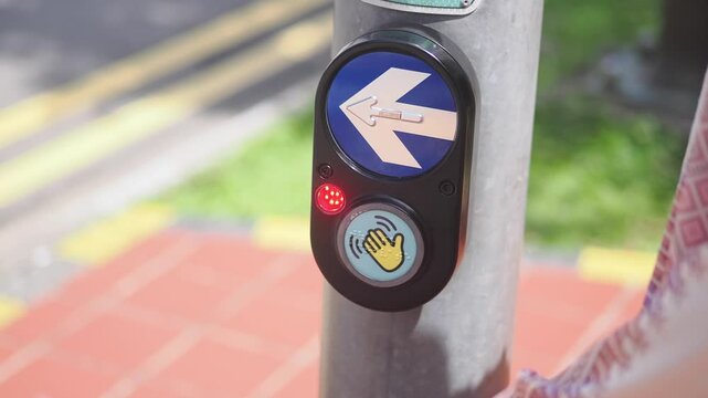Crosswalk button near intersection in a city street