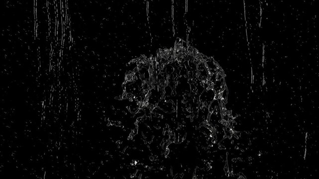 Water droplets falling on black background