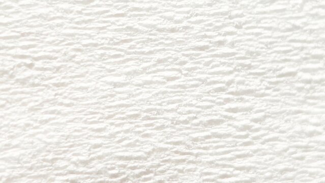White textured paper background with rough embossed surface