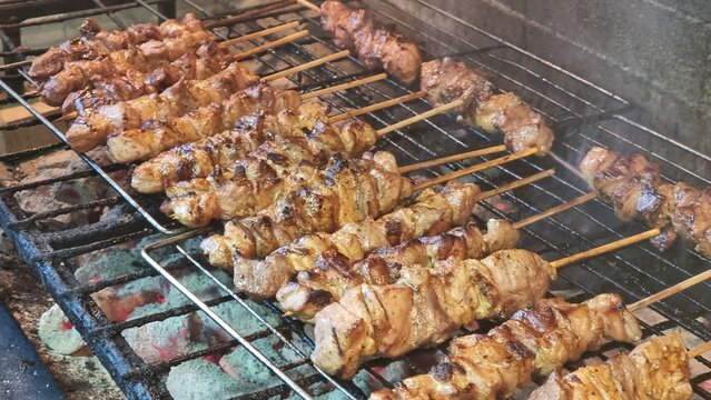 souvlakia meat preparing grilled on fire