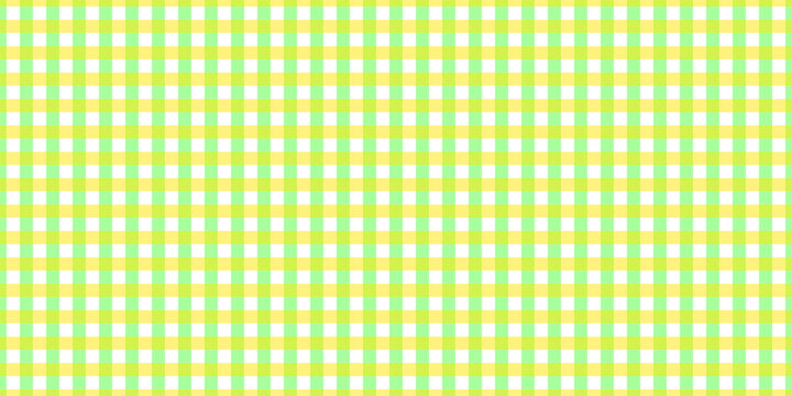 Seamless green and yellow gingham pattern background with classic plaid texture for textile, wallpaper and decorative design