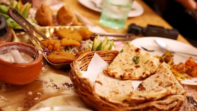 Traditional Indian Platter with Naan Bread Samosas and Pakoras