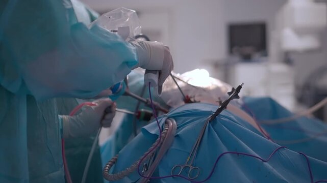 Surgical surgery health care team operating in operation room. Surgeons in hospital performs surgical procedures. Team of doctors processing surgical operation in modern emergency.