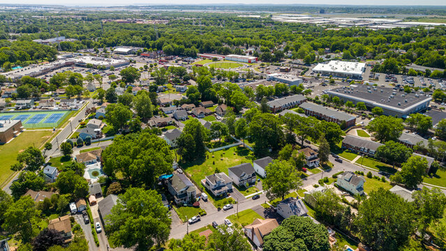 Aerial view showing suburban homes and commercial development