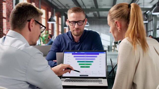 Marketing Manager And Team Analyze Sales Funnel Metrics
