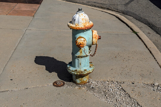 Weathered Fire Hydrant on Sidewalk in Boulder, Colorado