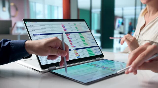 Medical Billing Analyst Reviews Coding Spreadsheets On Laptop