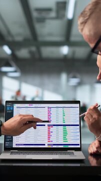 Billing Analyst And Team Reviewing Coding Spreadsheets