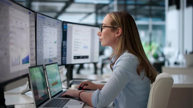 Compliance Officer Carefully Reviews Risk Dashboard On Laptop