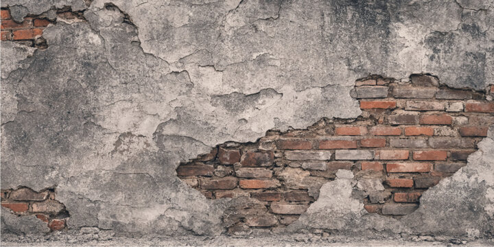 Old plaster wall texture with cracked deteriorating surface exposing red bricks underneath for construction renovation architecture design