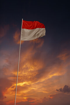 National flag of Indonesia in evening sky for holiday card design