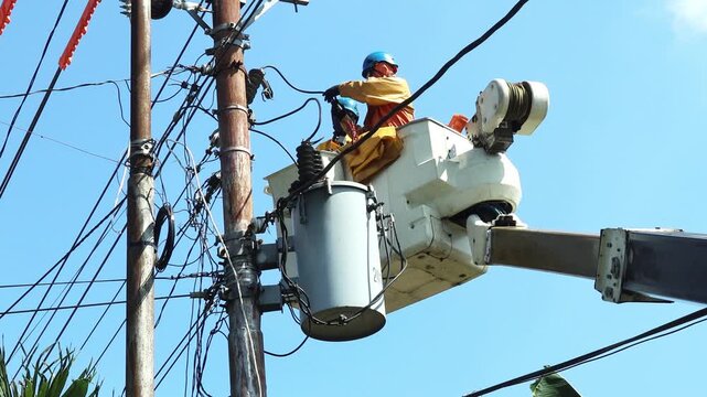 Electric Linemen Connecting Single-Phase Distribution Transformer to Energized 20 kV Overhead Power Line