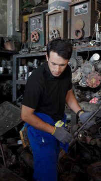 Mechanic Portrait Standing Among Engine Spare Parts In Workshop