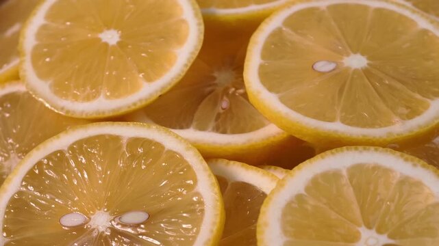 Close up display of fresh yellow lemon slices 