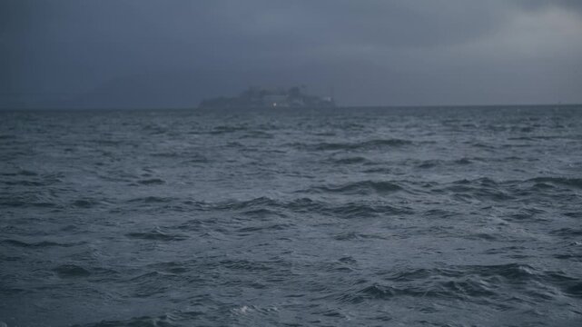 Misty View Of Alcatraz Island Across Choppy San Francisco Bay On Stormy Day - Wide Shot