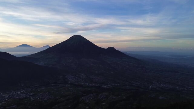 Aerial Drone View of Sunrise Between Mountain Ranges with Peaceful Morning Landscape