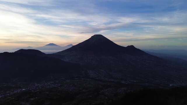 Aerial Drone View of Sunrise Between Mountain Ranges with Peaceful Morning Landscape