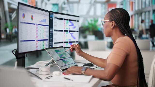 Medical Biller Carefully Reviews Codes On Laptop