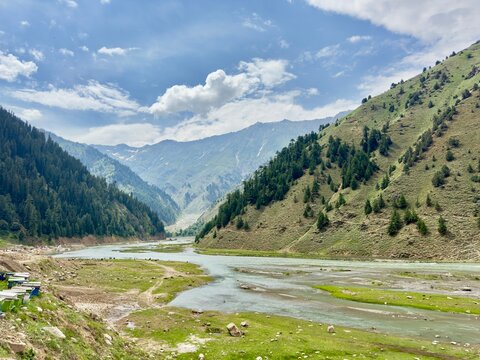 Scenic Kunhar River Valley Near Babusar Highway Pakistan with Green Mountains Pine Forest Blue Sky and Beautiful Summer Landscape in Kaghan Valley Northern Pakistan