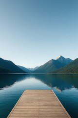 Obraz premium Clean symmetry of a majestic mountain range viewed from an empty wooden boardwalk
