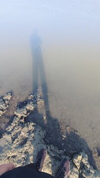 Shadow of Person on Shoreline