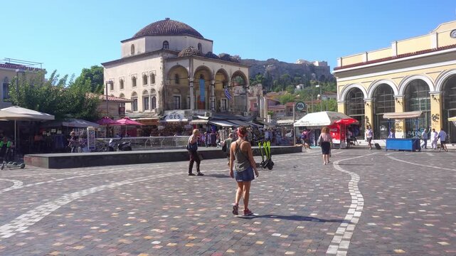 Female tourist walking through Monastiraki Square in Athens, Greece