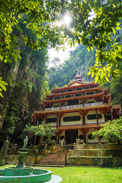 Sam Poh Tong multi-tiered pagoda nestled between limestone karst cliffs, Ipoh, Malaysia