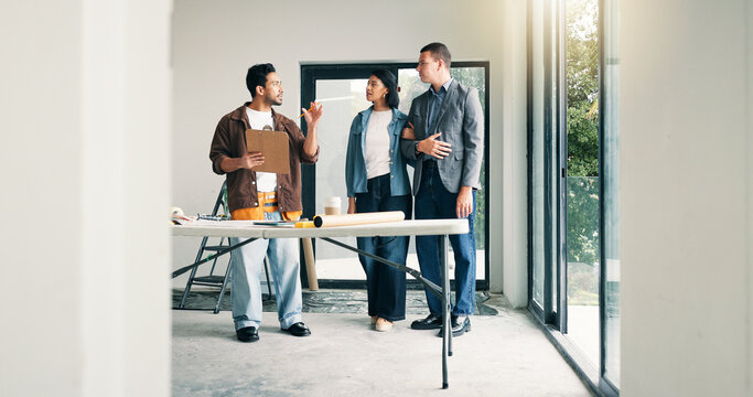 Designer, couple and discussion with homeowner in agreement, deal and planning at construction site. People, client collaboration and conversation for dream home, expansion or building remodeling