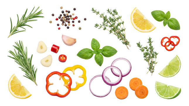 Fresh vegetable and herb assortment with lemon and onion slices for healthy cooking.
