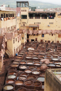 Fez Leather Tannery in Morocco. Leather dying in a traditional tannery in Fes. Workers dye leather in traditional tanneries, a centuries-old process, amid the city's ancient medina. 