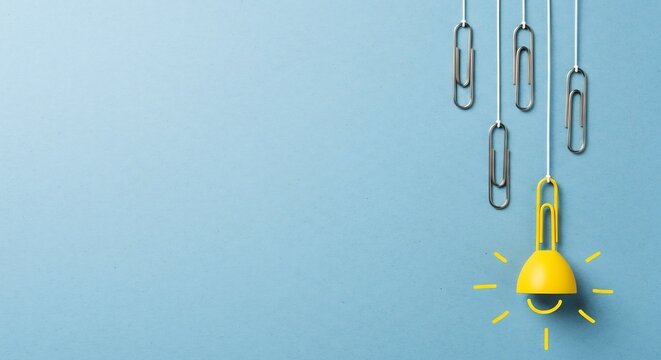 Hanging Light Bulb With Paper Clips Creative Idea Concept