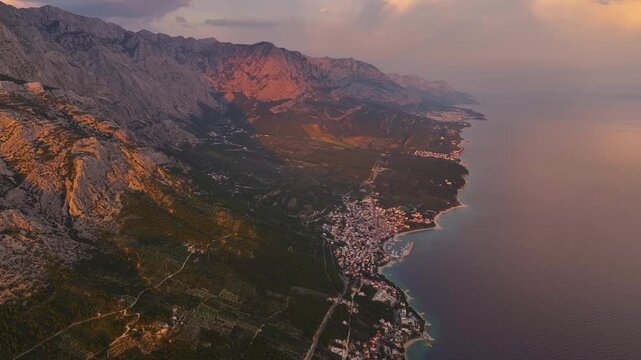 Brela Croatia views from above with mountains, coastline, and water visible at sunset