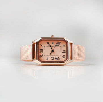 Elegant Rose Gold Rectangle watch with Mesh Strap isolated on White Background