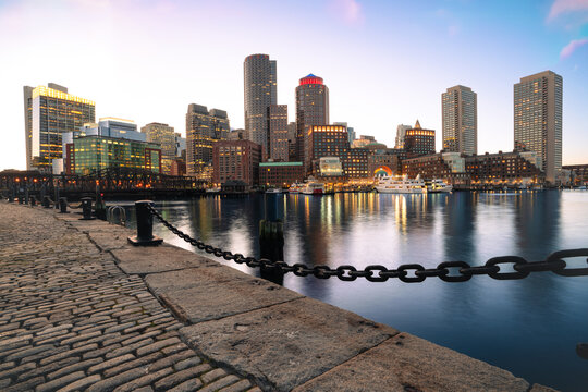 Title: Boston Skyline and Harbor at Twilight with Cobblestone Walkway Foreground