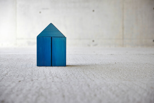 Model house made of building bricks on a construction site